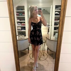 Blue Life black floral mini dress in size XS.